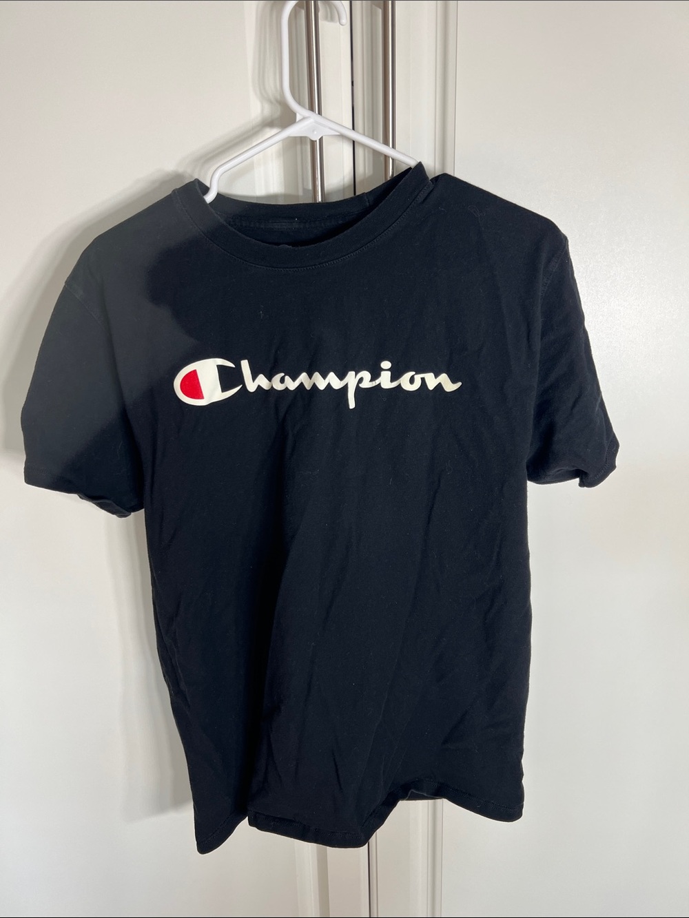 Champion Black Tee with White Script and Red Emblem